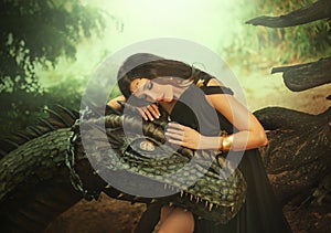 Fantasy woman evil dark queen witch hugs dragon, touching with hands head. Girl mistress tamed myth monster, concept of