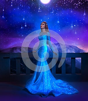 Fantasy woman princess stands on balcony looks at night sky space cosmos stars. Girl enjoy magic starfall ball. Elegant