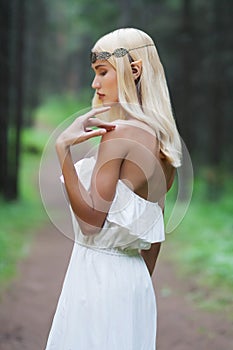 Fantasy young woman in woods