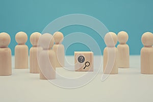 FAQ. Ask online. Frequently asked questions. Basic information. Wooden figures, question mark and magnifier signs photo