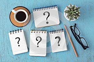 Faq concept Question marks on notepads