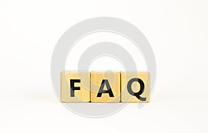 FAQ, frequently asked questions symbol. Wooden cubes with word `FAQ, frequently asked questions`. Beautiful white background.