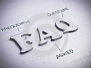FAQ, Frequently Asked Questions. Words Typography Concept photo