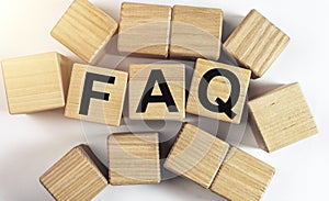 FAQ and QA concept. inscription on wooden dices