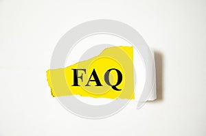 FAQ the text is written on a white background and a yellow piece of paper. word