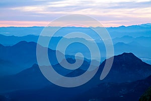Far mountains with blue haze and clouds