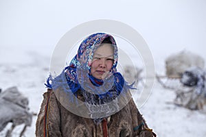 Far north, tundra, a girl-helper of the reindeer herder, a girl in national clothes, portrait