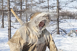 Far north of Yamal, tundra, pasture nord reindeers, closeup portrait of Nenets at age, close-up portrait of Nenets in national