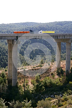 Far view of bridge with two lorries photo