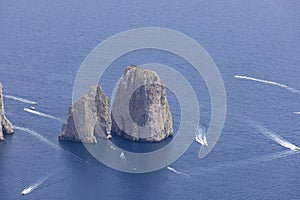 Faraglioni, attractive coastal rock formation eroded by waves, Capri, Italy