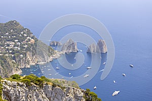 Faraglioni, attractive coastal rock formation eroded by waves, Capri, Italy