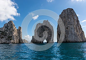 The Faraglioni of Capri, the symbol of the island, located in the guf od Naples, Campania, Italy.