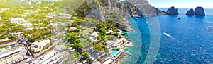 Faraglioni from Marina Piccola Beach in Capri, Italy. Aerial view from drone