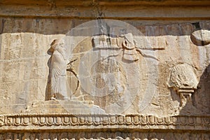 Faravahar Royal tombs facade, symbol on the ruins of old city Pe