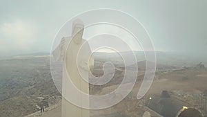 Faraya Mountain and Saint Charbel Statue drone view in a cloudy day