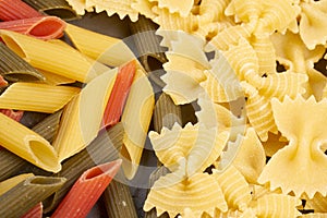 Farfalle and colored penne texture