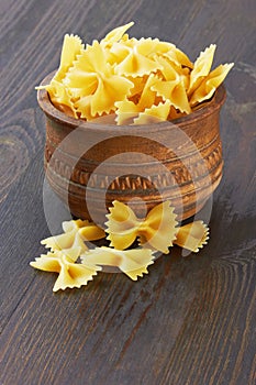 Farfalle italian pasta in wood bowl