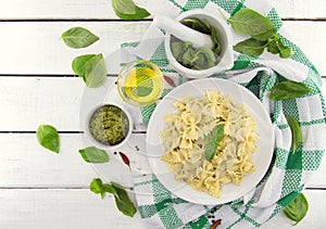 Farfalle pasta with pesto genovese & x28;basil sauce& x29; on white rusti