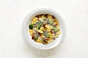 Farfalle pasta with roasted broccoli and mushrooms in bowl