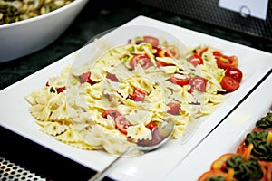 Farfalle with sweet red pepper and tomatoes