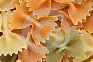 Farfalle tricolore pasta background