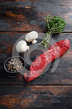 Farm bio Tri tip steak with fresh seasoningsm thyme, organic tri-tip roast with fat marbled through the meat ready to roast or