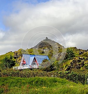 Farm buildings below the mountain