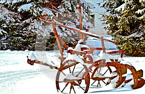 Farm Cultivator in Snow