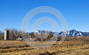 Farm and Distant Mountains