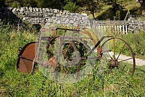 Farm equipment abandoned and rusty