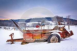 Farm equipment in a snow covered field in rural Carroll County,