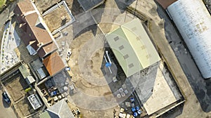 Farm and farmyard buildings in rural countryside aerial view from above