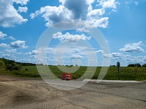 Farm field with an orange construction barrel