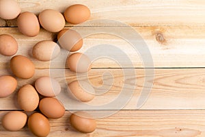 Farm fresh brown eggs on a wooden table