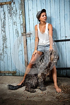 Farm girl with her dog.