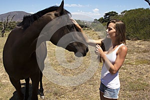 Farm girl speaking horse