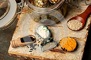 Farm goat cheese chevre in balls. Jar of Cheese balls with olive oil. selective focus