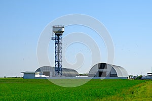 Farm hangars and tower. Large storage for agricultural crops. Agribusiness concept
