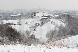 Farm on hill in winter