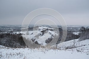 Farm on hill in winter