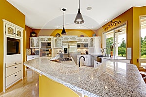 Farm house interior. Luxury kitchen room with big island and granite top