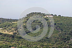 Farm house over a hill in Santiago do Cacem