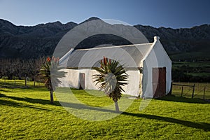 Farm in the Karoo with old rural houses and the swartberg mountains in south africa,