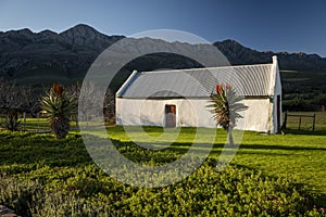 Farm in the Karoo with old rural houses and the swartberg mountains in south africa,