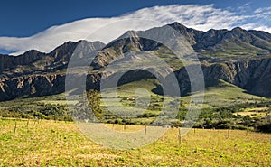 Farm in the Karoo with old rural houses and the swartberg mountains in south africa,