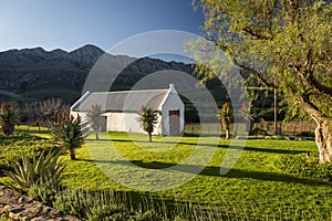 Farm in the Karoo with old rural houses and the swartberg mountains in south africa, photo