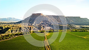 Farm landscape adjoining to badlands in Utah.