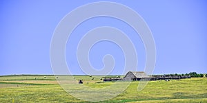 Farm landscape with grassland, trees and prairie