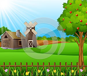 Farm landscape with shed and brown windmill on daylight