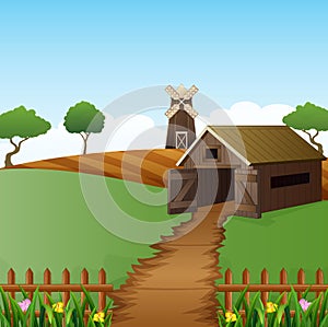 Farm landscape with shed and brown windmill on daylight